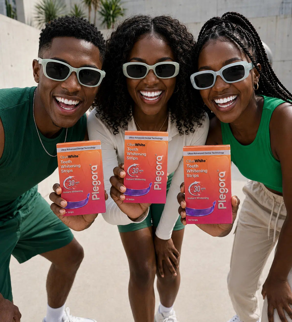 Happy customers holding OliveWhite whitening strips